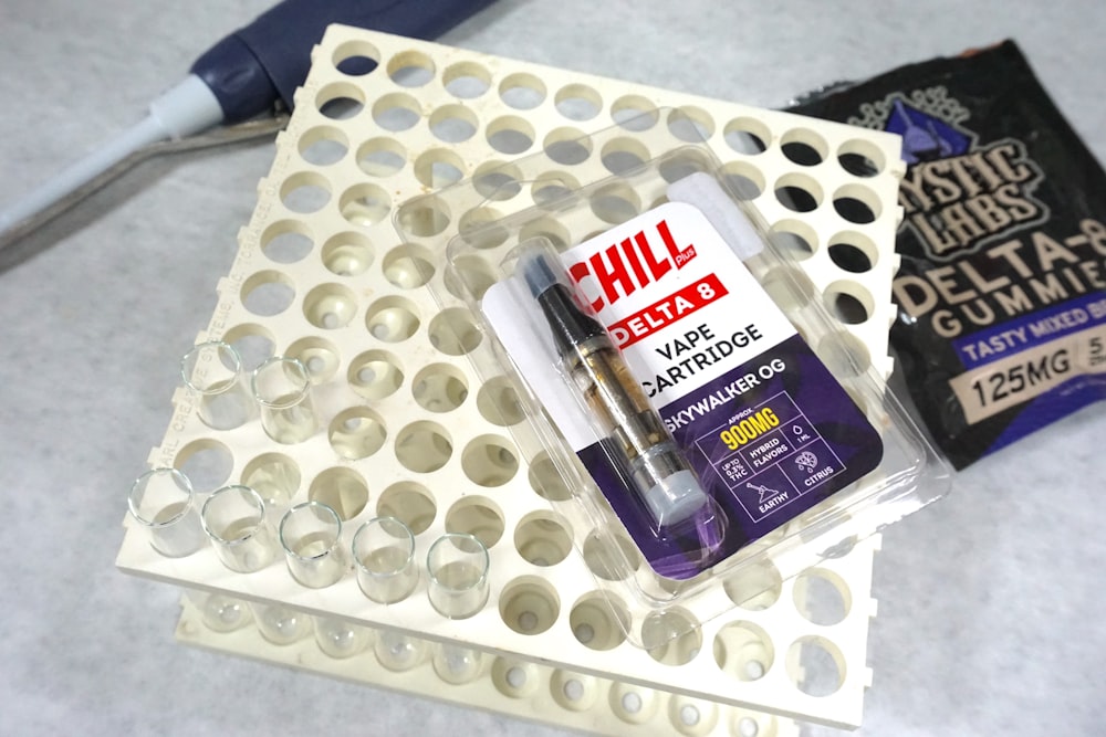 a couple of tubes of glue sitting on top of a tray