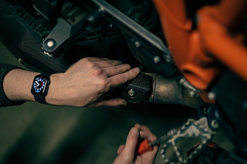 a close up of a person working on a motorcycle