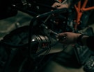 a close up of a person working on a motorcycle