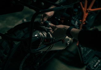 a close up of a person working on a motorcycle