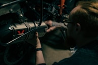 a man working on a motorcycle with a wrench