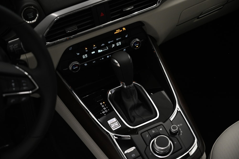 a close up of a car's dashboard with a steering wheel