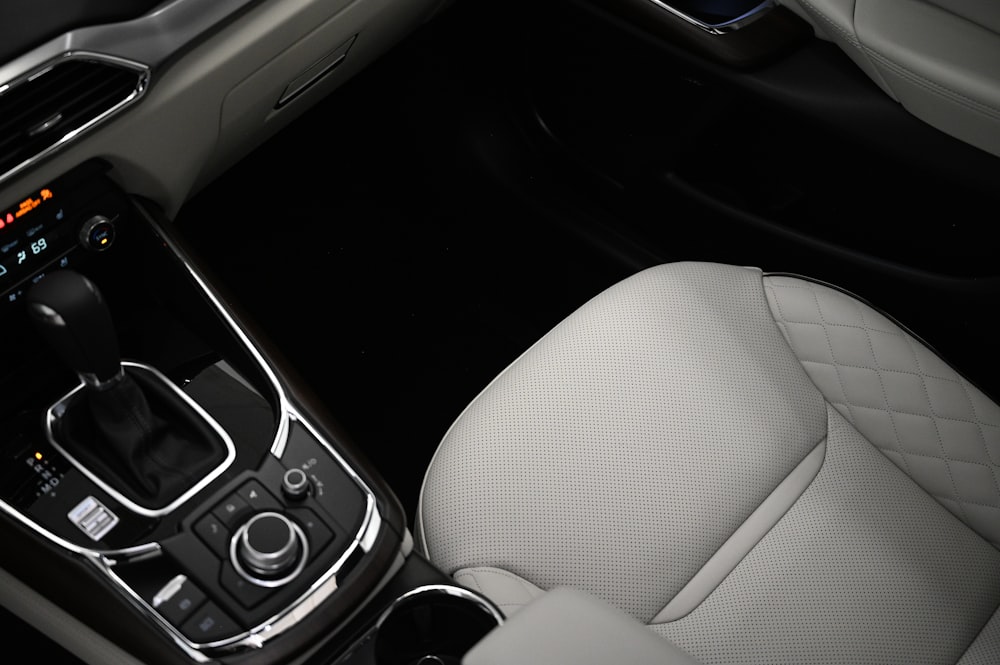 the interior of a car with a steering wheel and dashboard