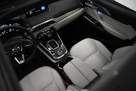 the interior of a car with a steering wheel and dashboard
