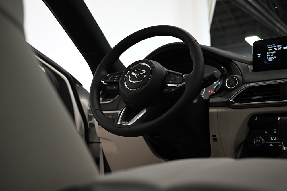 the interior of a car with a steering wheel