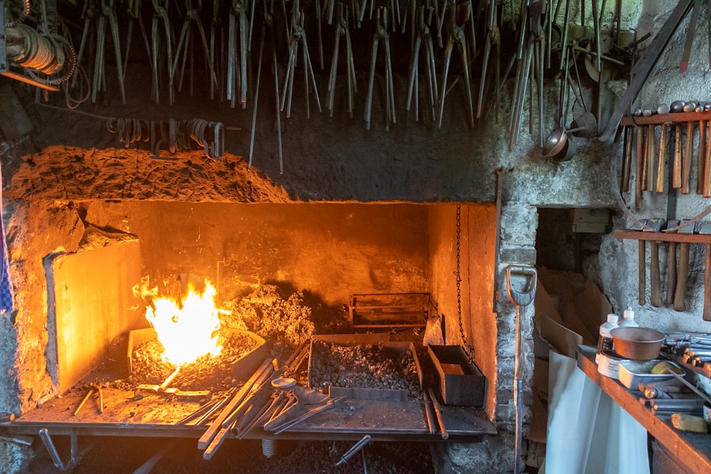 a fire burning inside of a stone oven