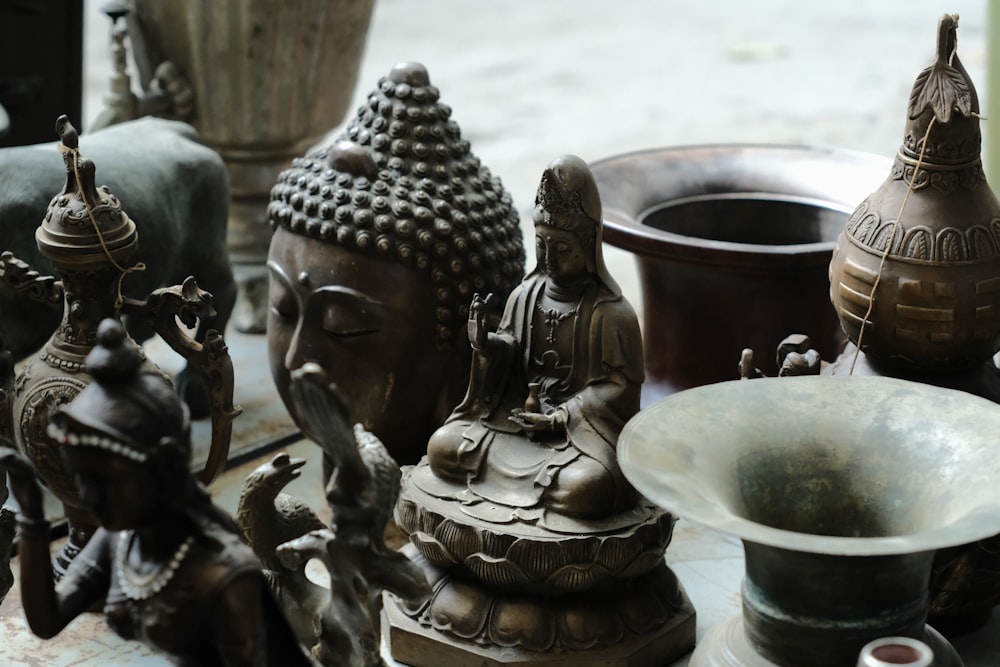 a group of statues sitting on top of a table