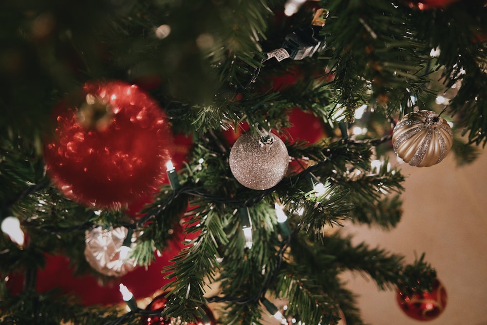 a close up of a christmas tree with ornaments