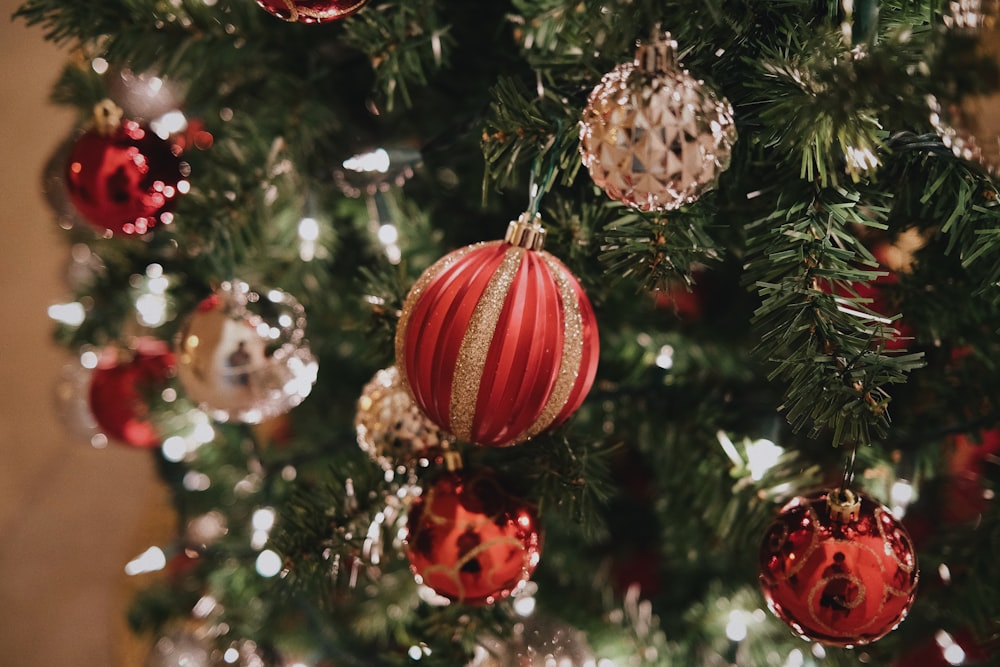 a close up of a christmas tree with ornaments