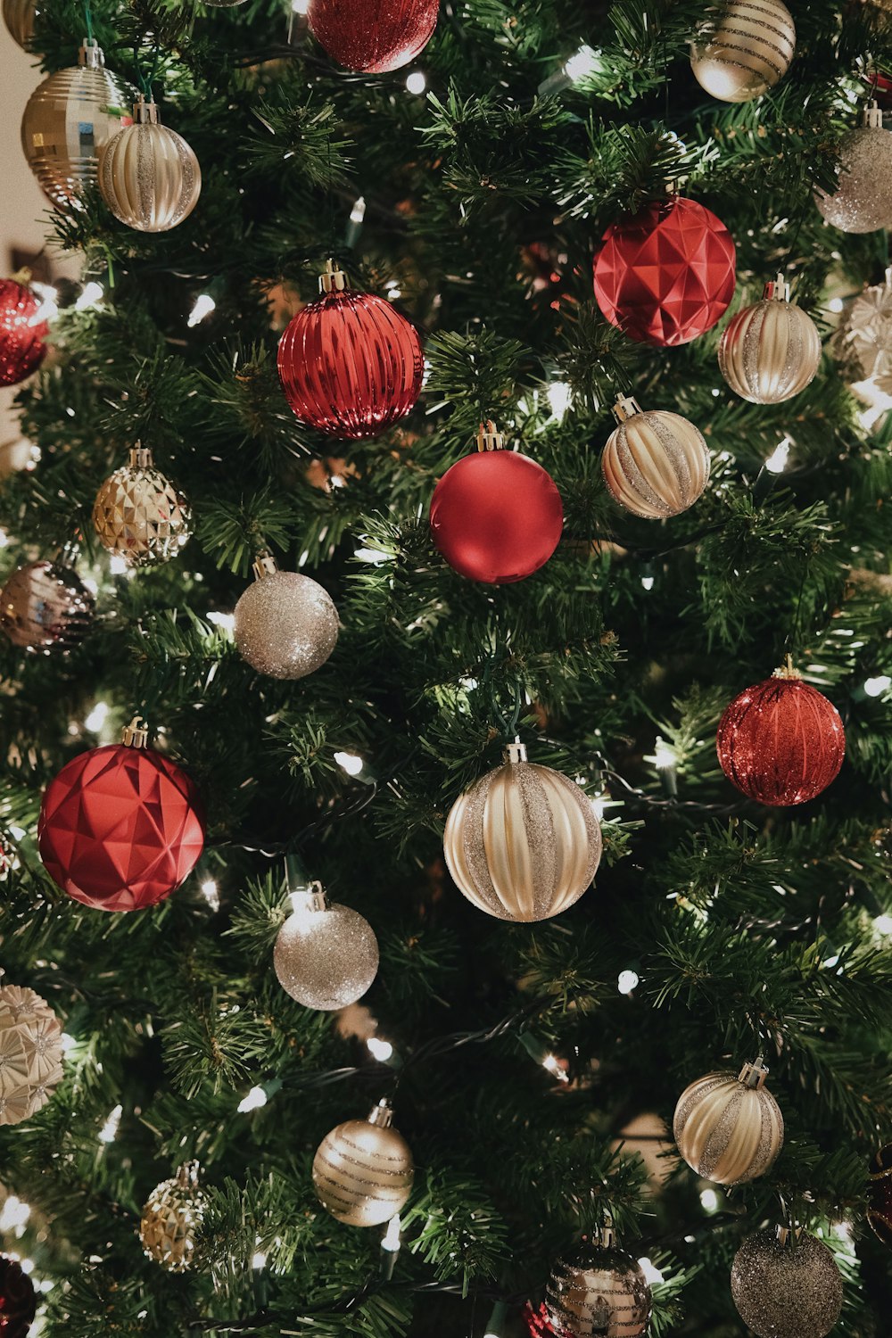 a close up of a christmas tree with ornaments