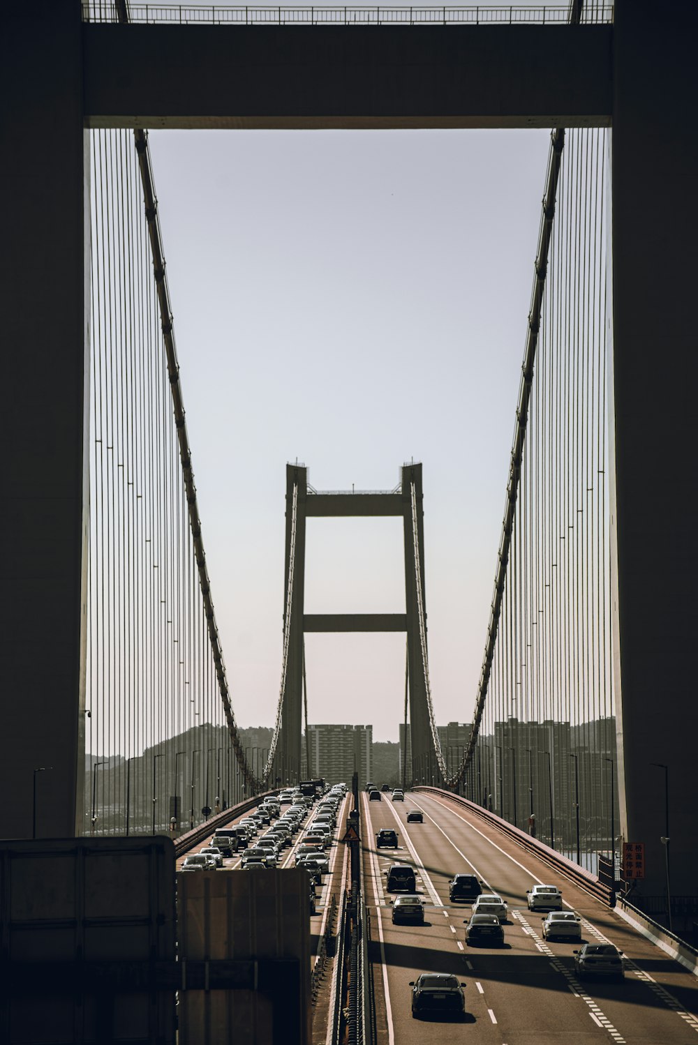 a view of a bridge with cars driving on it