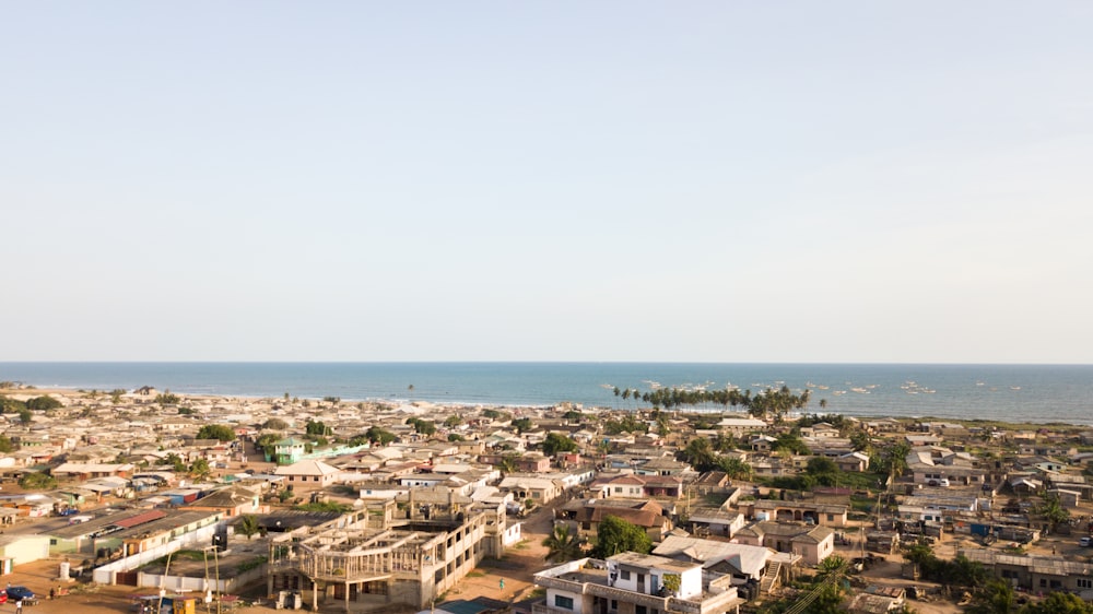 a view of a city with a body of water in the background