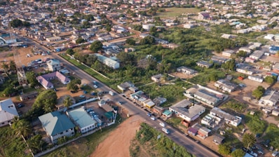 Aerial view of a suburban neighborhood with green spaces.