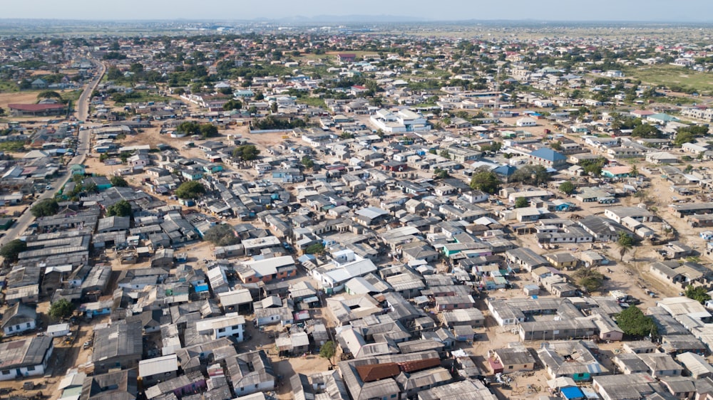 an aerial view of a city with lots of houses