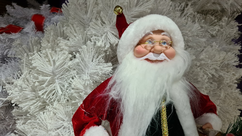 a close up of a santa clause on a christmas tree