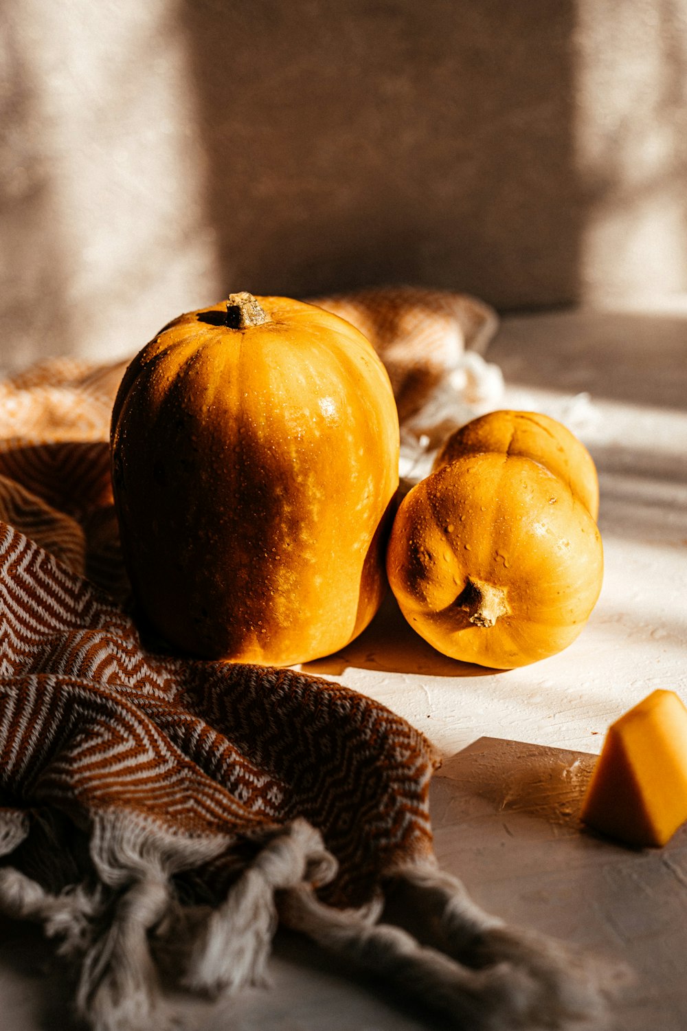 a couple of pumpkins sitting on top of a table