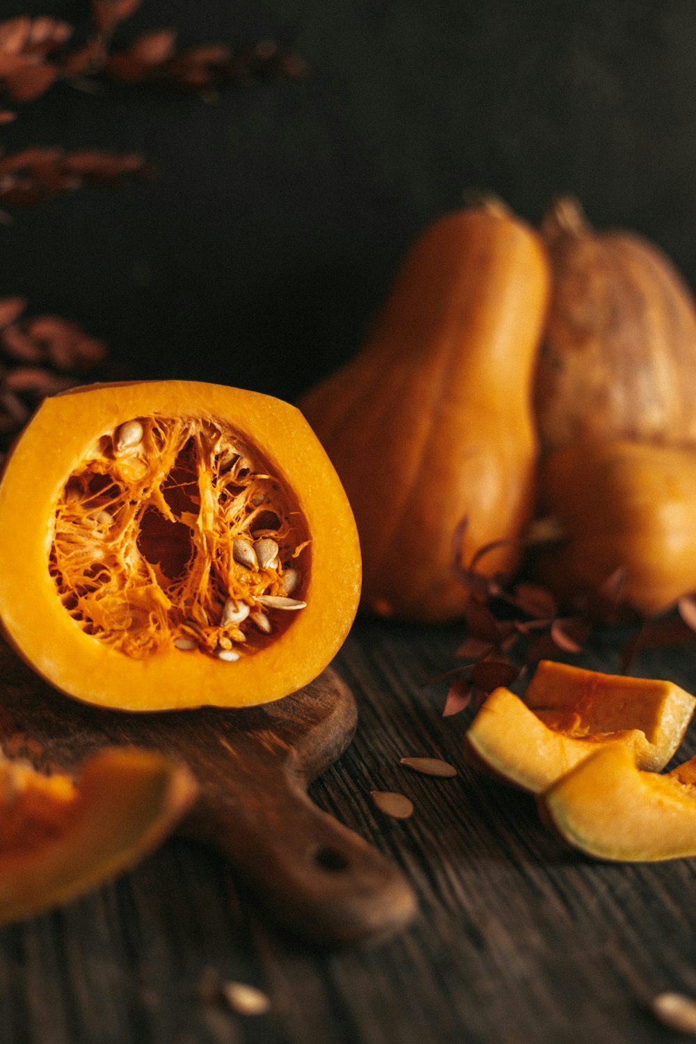 a peeled orange sitting on top of a wooden table