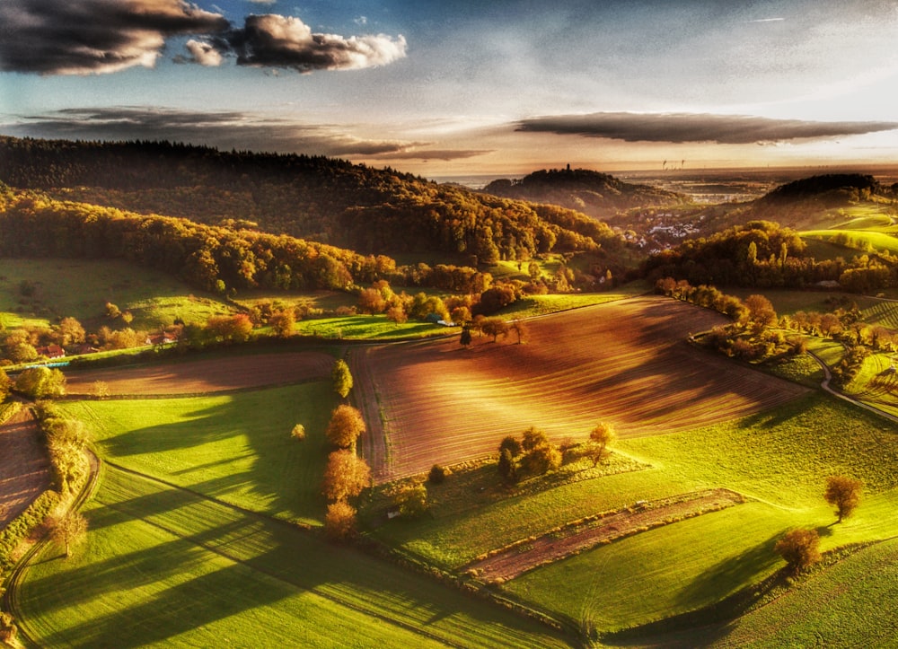 an aerial view of a countryside with rolling hills