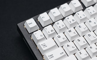 a close up of a keyboard on a black surface