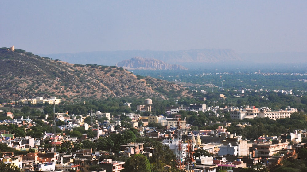 a view of a city with mountains in the background