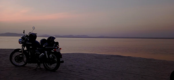 Close-up of a Honda Activa 6G with the golden sands of Puri Beach in the background.