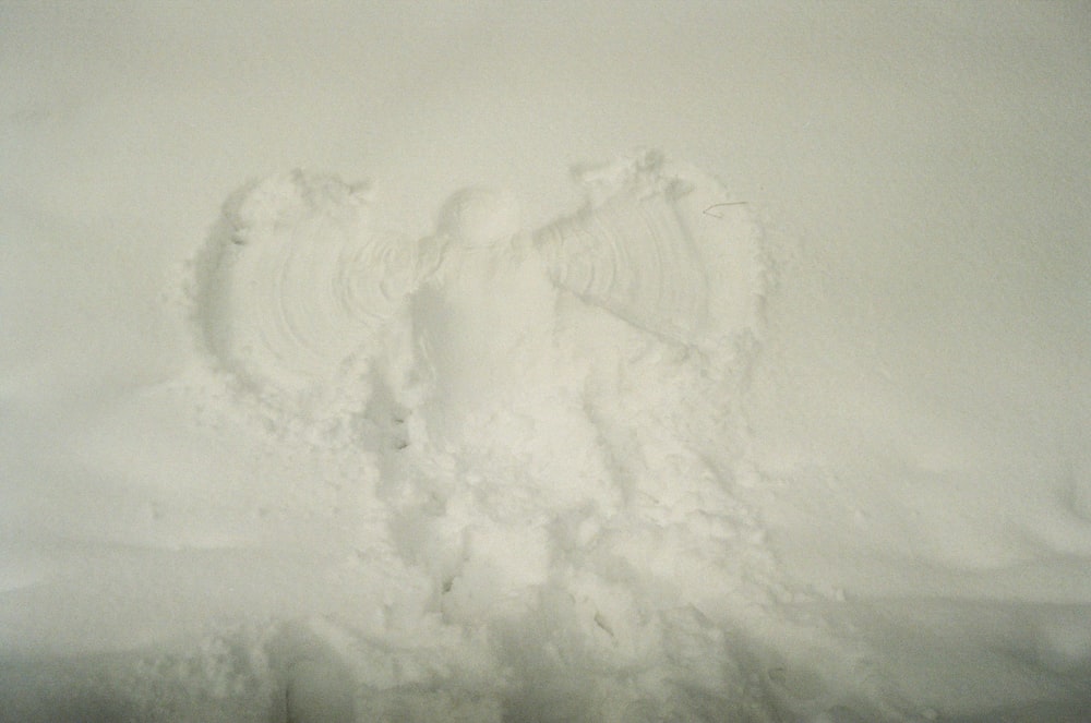 a person standing in the snow with their feet in the snow