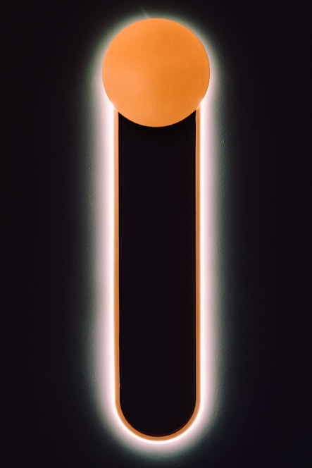 A sleek, dark-themed dashboard interface glowing with teal and orange neon accents.