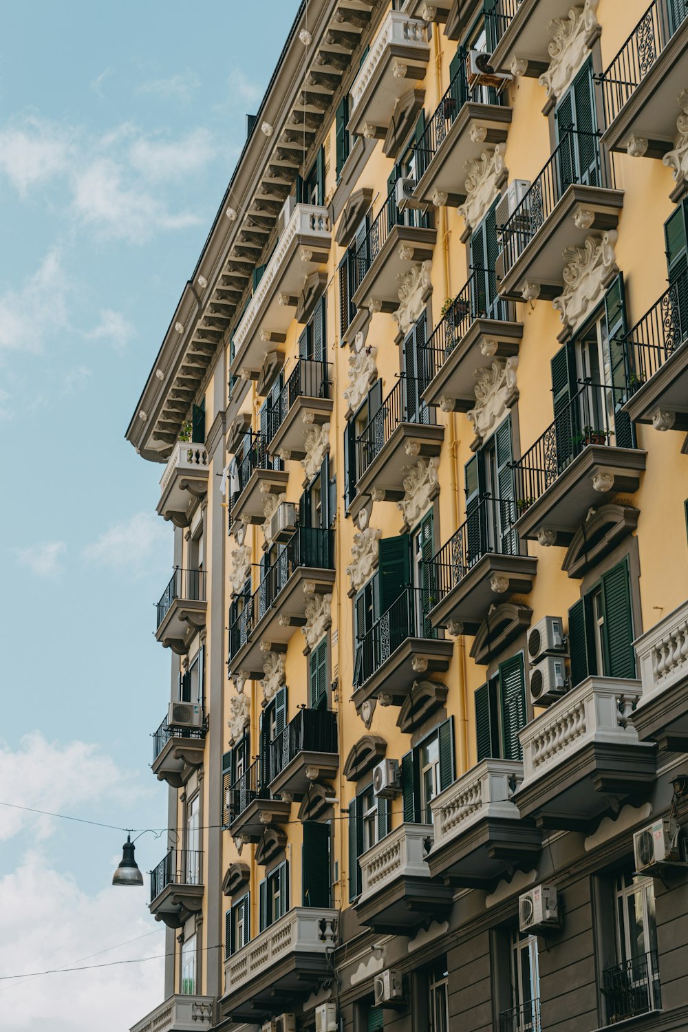 a tall building with balconies and balconies on the balconies