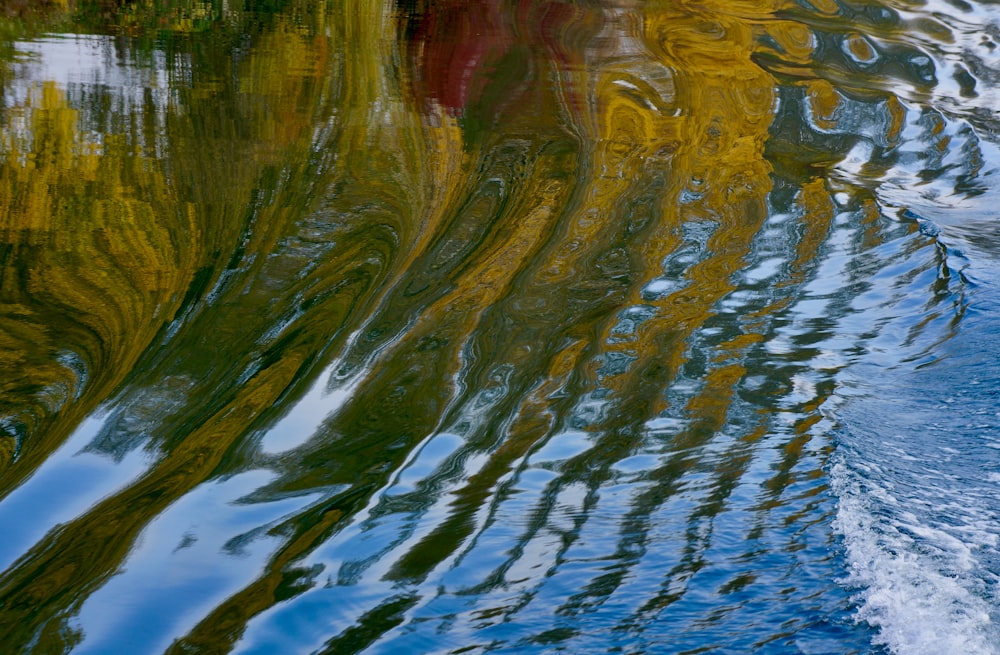 the reflection of a boat in the water