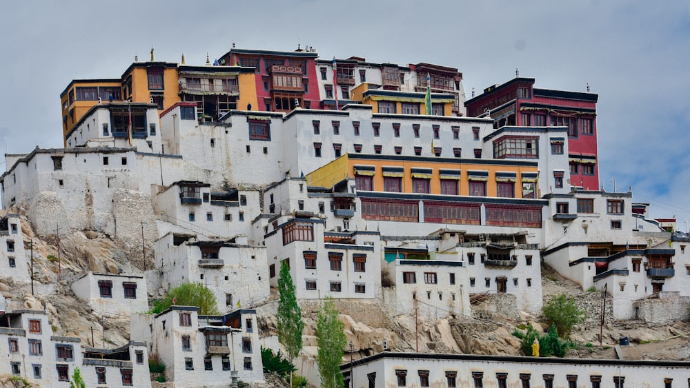 a large group of buildings on top of a mountain