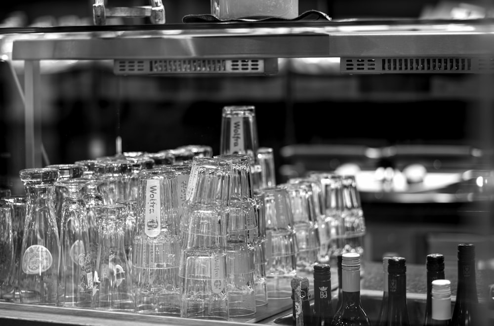 a bunch of empty wine glasses sitting on a counter