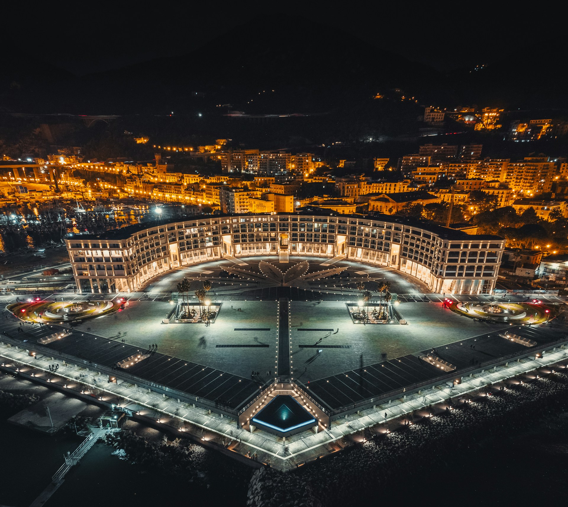 an aerial view of a city at night