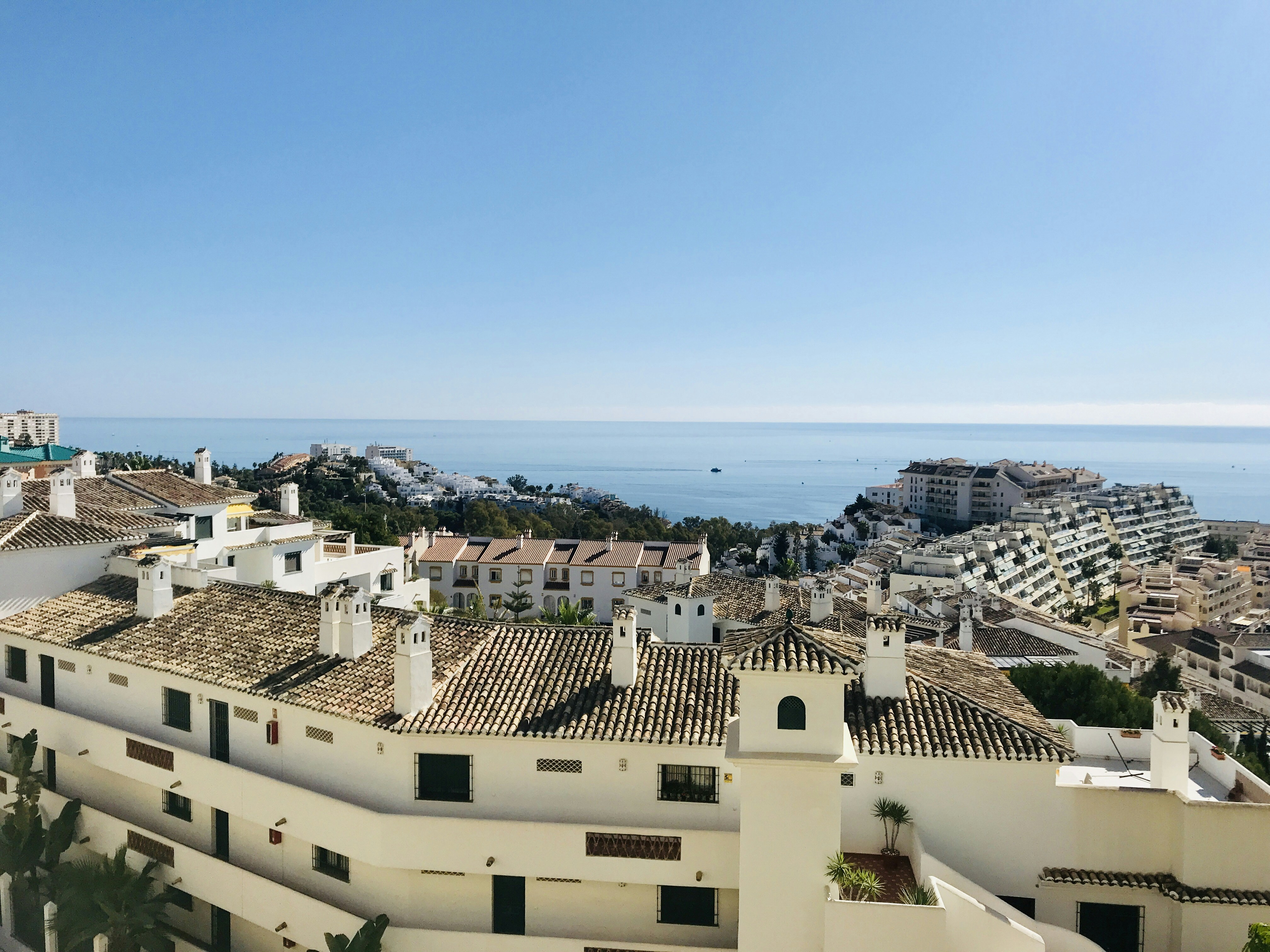 a view of a city and the ocean