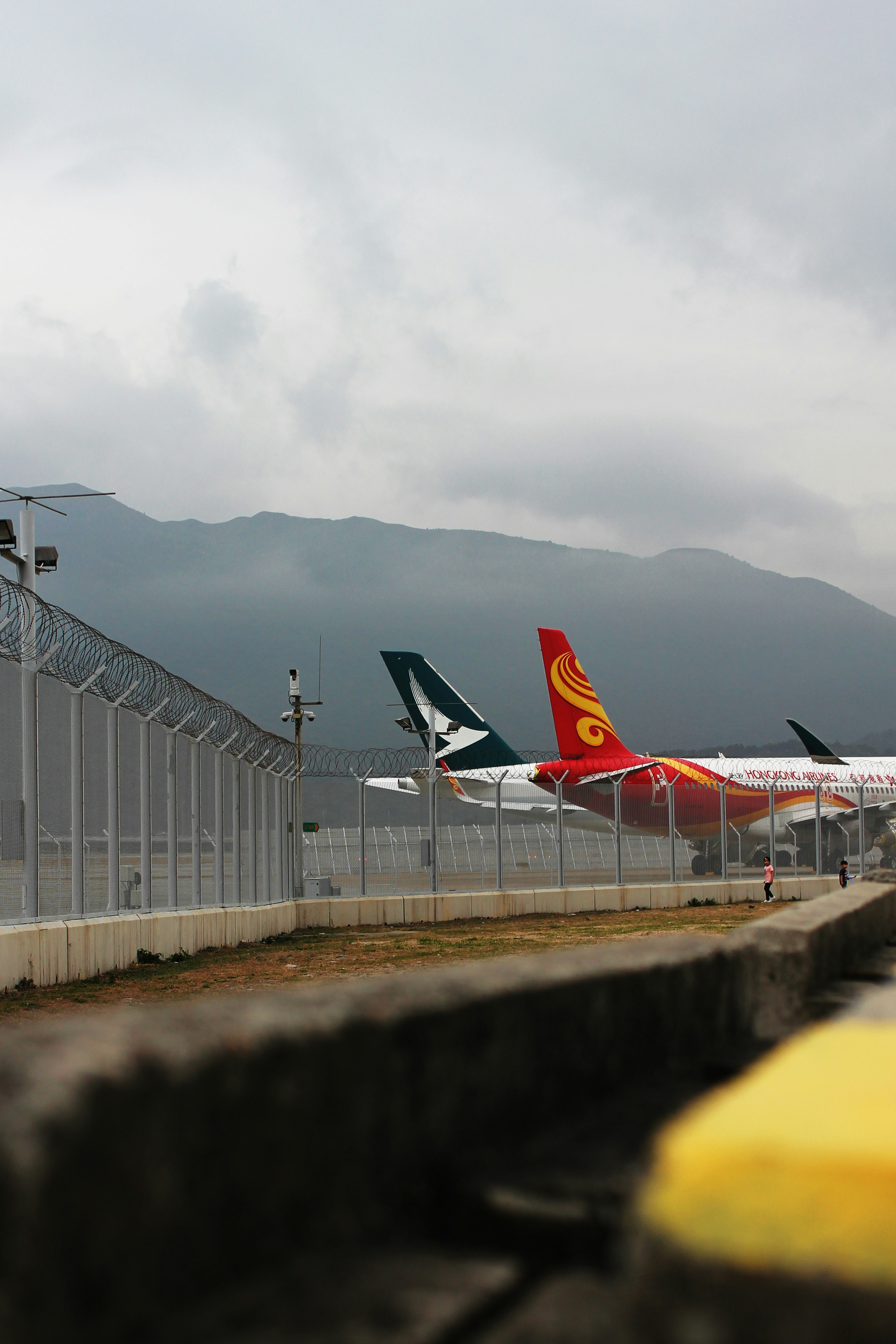 a couple of airplanes that are on a runway