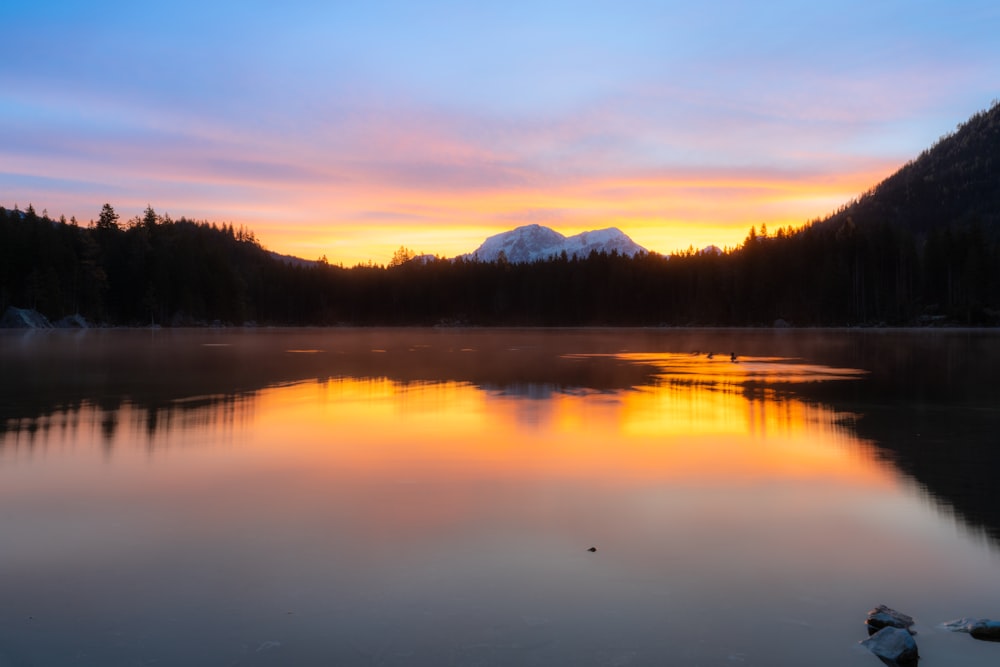 a lake with a mountain in the background