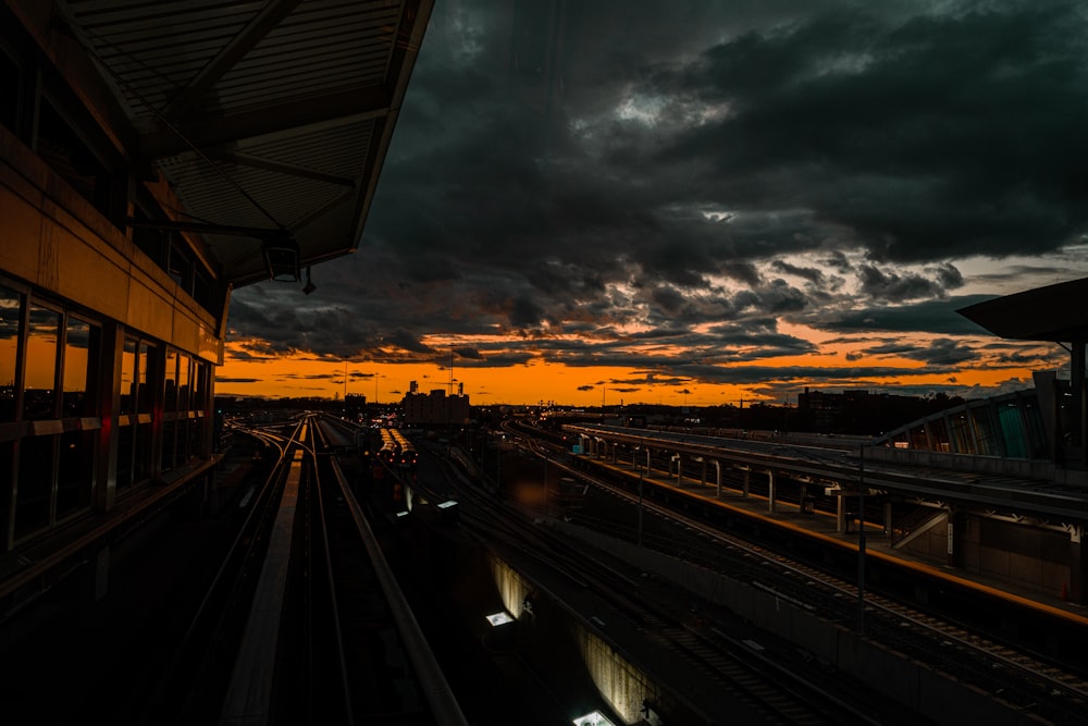 a view of a train station at sunset