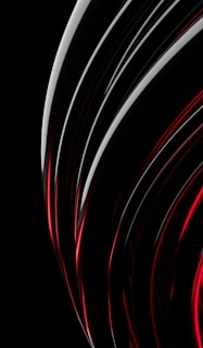 Free logo design sample combining sleek lines and red tones on a black canvas.