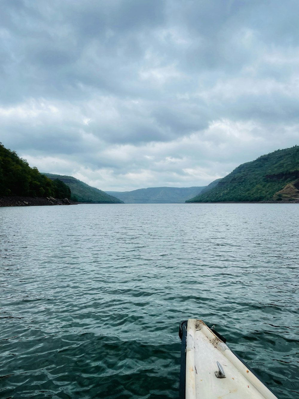 a boat floating on top of a large body of water