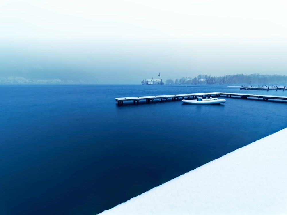 a long dock in the middle of a large body of water