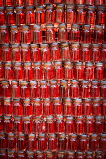 many jars are stacked on top of each other