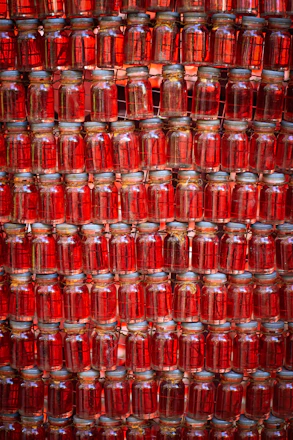 many jars are stacked on top of each other