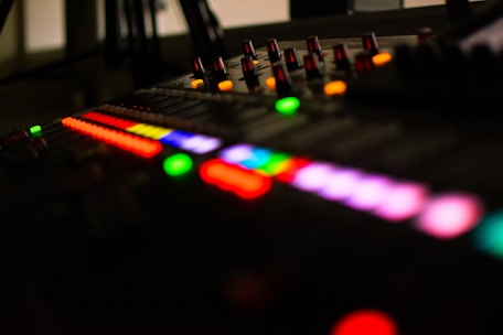 a sound board with a lot of colorful lights on it