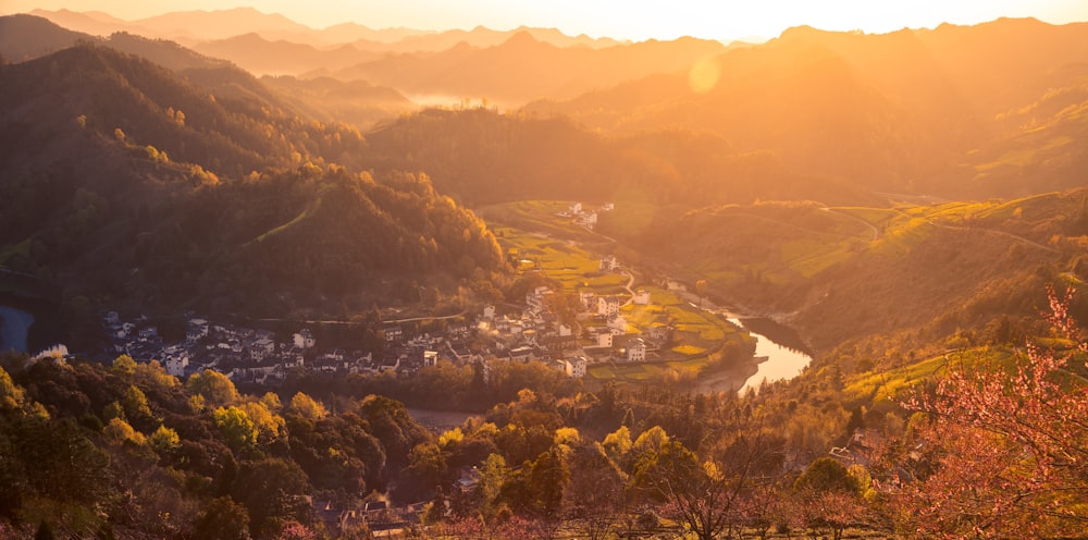 a scenic view of a valley with a river running through it