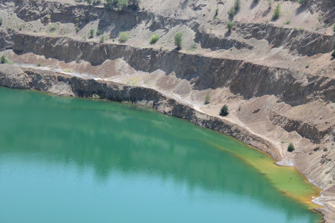 a large body of water surrounded by mountains,