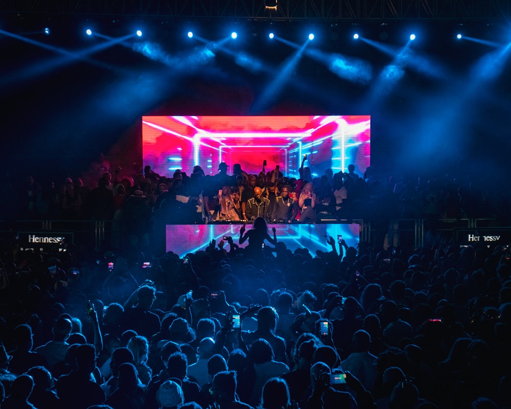 a group of people standing on top of a stage