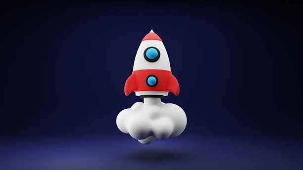 a red and white toy rocket on a blue background