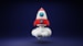 a red and white toy rocket on a blue background