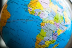 a close up of a blue and yellow globe