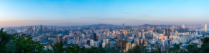 a view of a city from the top of a hill