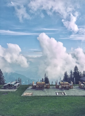 A scenic view of mountains with a family picnic setup.